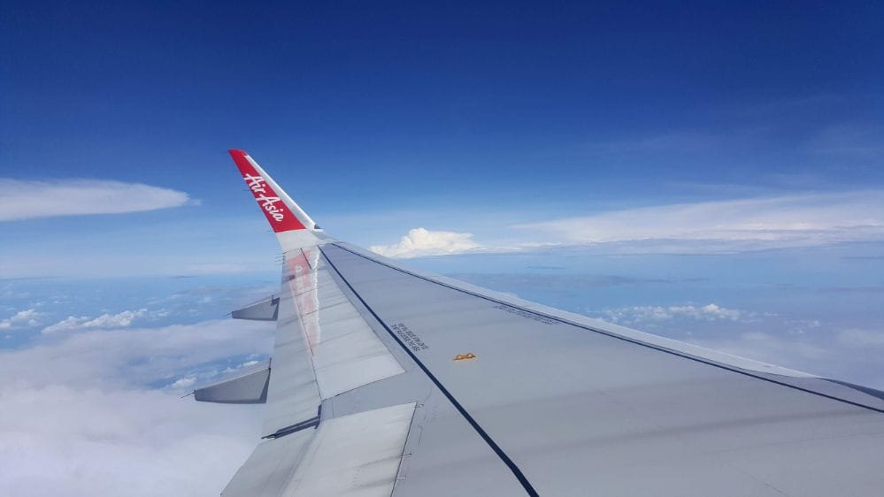 wing of airplane on sunny day