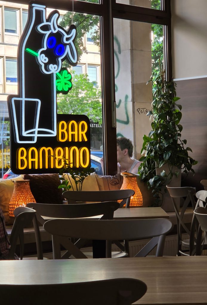 bar bambino sign of cow and glass to symbolize milk bar of Poland